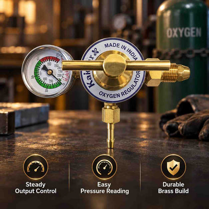 A brass oxygen regulator with a round analog pressure gauge, adjustment knob, and threaded connector, shown on a plain white background. The gauge has a white face with red, green, and black markings, and the main body is brass with a blue and white circular label reading 'K&H OXYGEN REGULATOR' and 'MADE IN INDIA'.